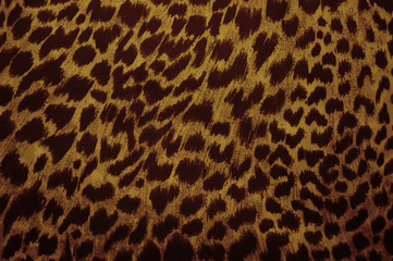 Leopard, jaguar. Fur pattern on the fabric. Print color and black and white.