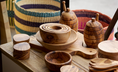 handmade wood bowls utensils and woven baskets
