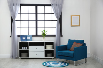 Modern furniture and window curtains in stylish room interior