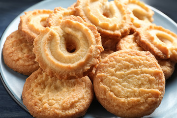 Plate with Danish butter cookies on table, closeup