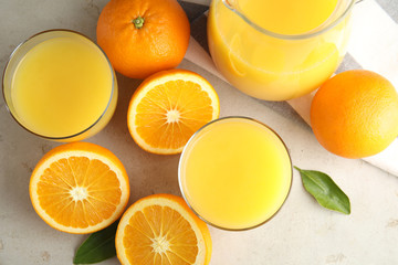 Flat lay composition with orange juice and fresh fruit on light background