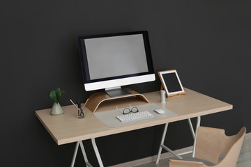 Modern workplace interior with computer on table. Space for text
