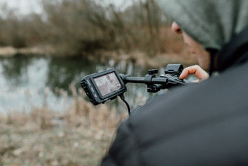 Camerman is holding the camera and recording