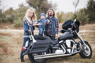 Naklejka premium Happy bikers family has a fun outdoor. Father's Day concept. Mother's Day concept. Family look.