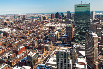 Obraz premium Boston, USA- March 08, 2019: panorama, a view from the air on the snowy Boston streets, Massachusetts, United States.