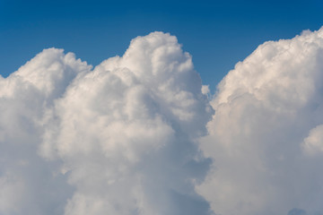 White clouds and blue sky, a view from airplane window