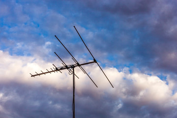 TV antenna point north durning sunset.