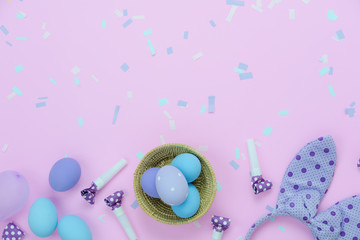 Table top view shot of decorations Happy Easter holiday background concept.Flat lay eggs with cute bunny ear & confetti for decor party festival on modern rustic pink paper.Copy space for design web.