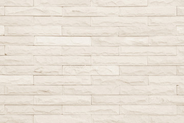 Cream and white brick wall texture background.