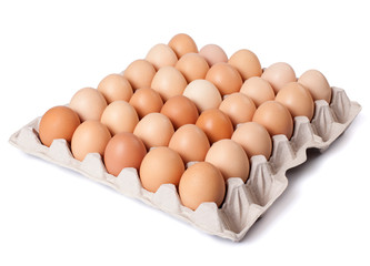 Eggs in cardboard box isolated on white background. Full depth of field.