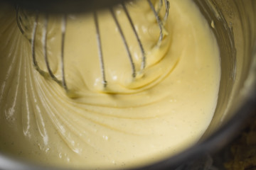 Kitchen aid mixing thick and creamy vanilla cream.