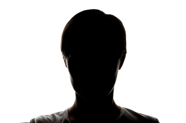 Dark silhouette of a young girl on a white background, the concept of anonymity