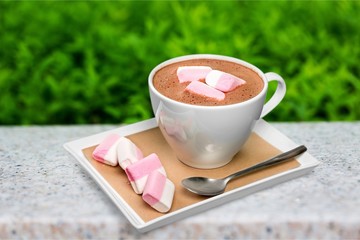 Coffee in paper cup on  background