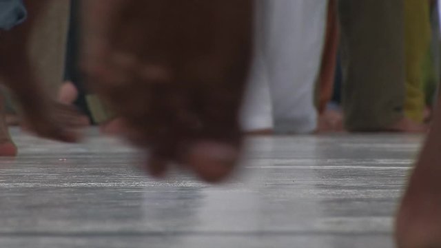 Close Up Of Bare Feet Walking In An Indian Temple