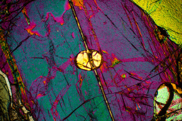 Digitally manipulated, abstract micrograph of olivine pyroxenite with polariztion.