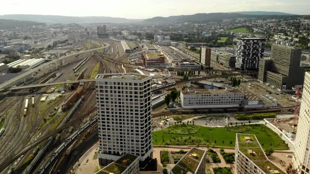 Drone shot flying above train tracks in Z&uuml;rich Switzerland