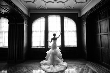 Bride posing in window