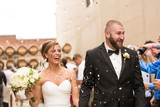 Smiling Bride and Groom with confetti