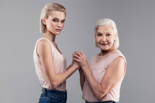 Same Short-haired Woman With Grey Eyes But Different Ages