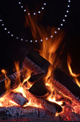 Beautifully burning logs in the grill