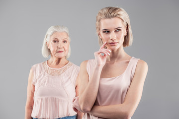 Thoughtful young woman with bob haircut looking aside