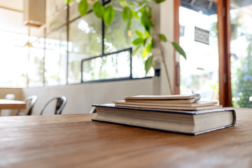 Books and notebooks on wooden table