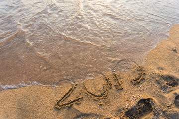 2019 Happy new year on seashore sand beach sunset colorful sky, Element of photo design