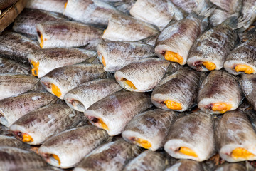 Close up Fishes (Trichogaster pectoralis) arrange on rattan in market.Raw food ingredients.