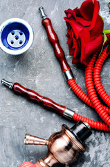 Smoking hookah with rose flavor