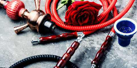 Smoking hookah with rose flavor