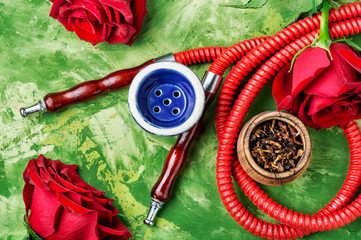 Smoking hookah with rose flavor