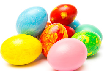 Easter background with handmade colored eggs.  Festive tradition on white backdrop