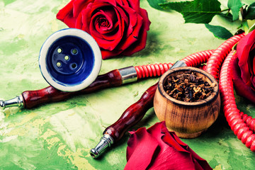 Smoking hookah with rose flavor