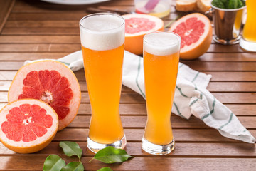 glass of sour Grapefruit Craft Beer on wooden table