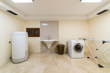 Laundry room with boiler