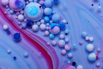 abstract background of stains and paint bubbles in liquid