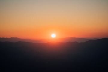 Sunset on the mountains in the winter months of February in Thailand