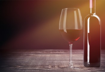 Red wine glass and bootle with shadow on withe background