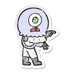 distressed sticker of a cartoon cyclops alien spaceman pointing
