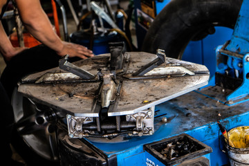 Fototapeta na wymiar Technician repair tire man fix wheel of car