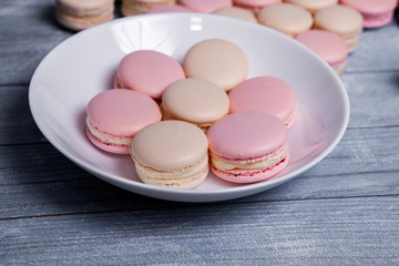 Close up colorful macarons dessert with vintage pastel tones French colorful macarons background, close up macaron or macaroons cookie, tasty dessert. food background