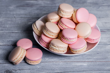 Close up colorful macarons dessert with vintage pastel tones French colorful macarons background, close up
