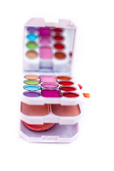 Mini make up kit or box isolated on white.