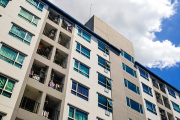 Modern condominium flat 8 floor building with blue sky cloud