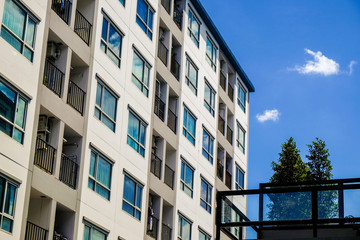 Modern condominium flat 8 floor building with blue sky cloud