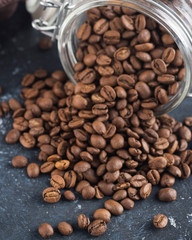  Coffee beans in glass jar . Freshness coffee beans. Closeup