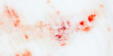 Red blood on white snow as a background