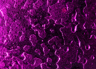 Ice on pink glass as abstract background