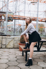 Young cheerful sexy lady walking outdoors in park. Adrenaline, beauty, lifestyle concept