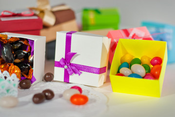 Handmade paper boxes. Gift boxes for candies. Small boxes on the table.